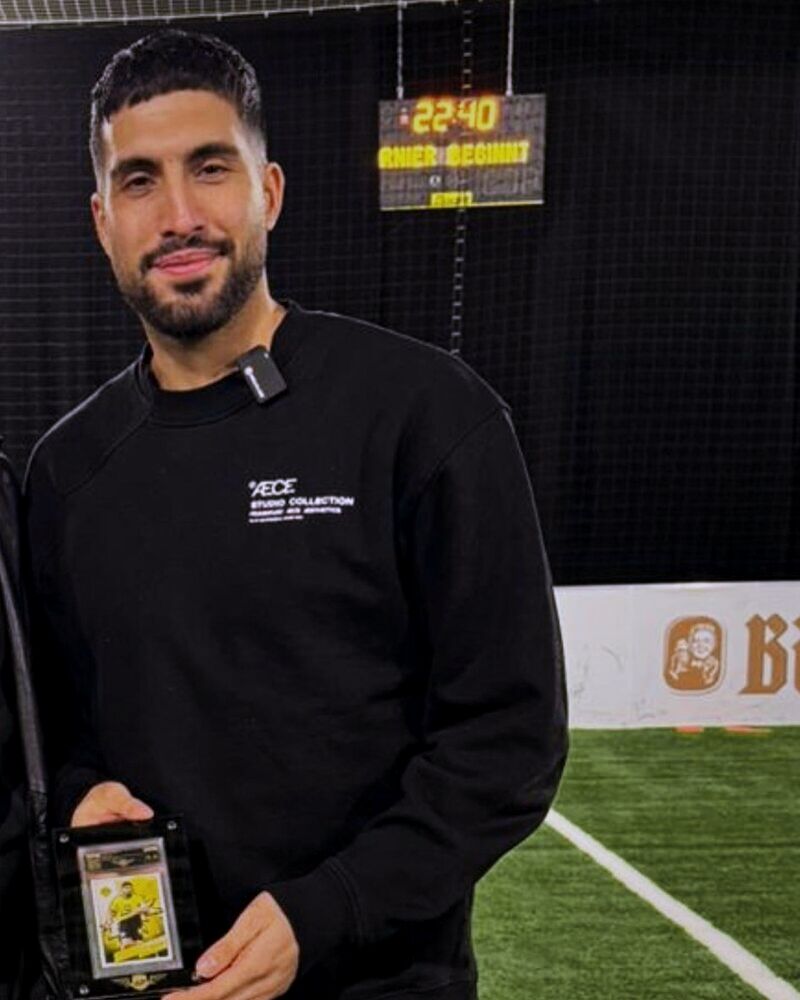 Bundesliga professional Emre Can (Borussia Dortmund) with his trading card graded by AP Grading in an AP slab